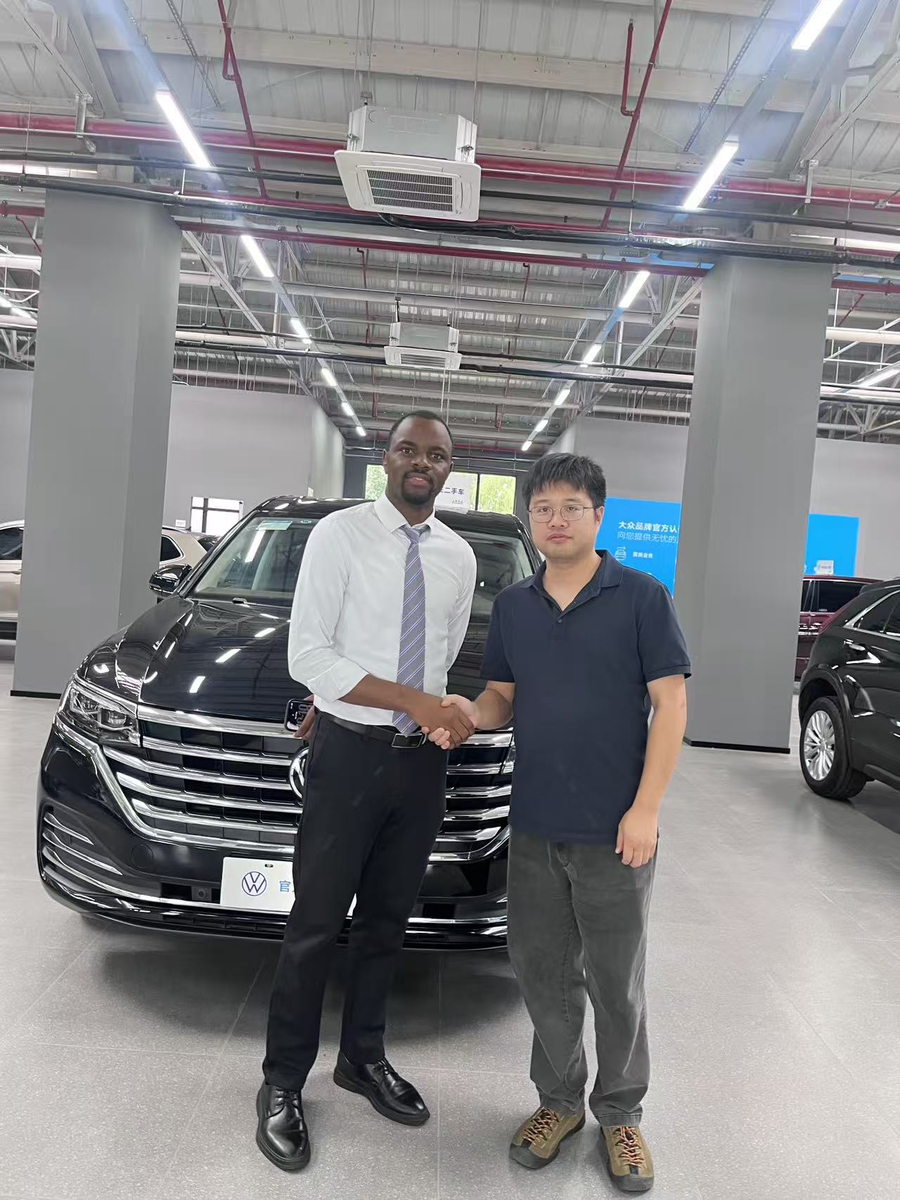 Partner handshake at BaiLian showroom